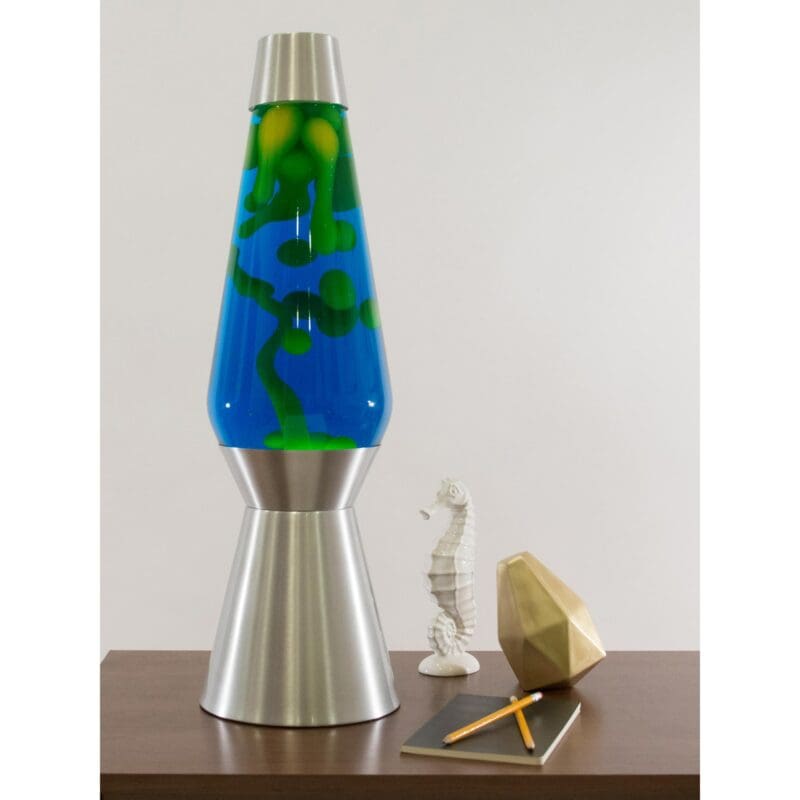 68240100US-LavaLamp-27-Yellow-and-Blue-web 27” LAVA® Lamp Grande – Yellow/Blue/Silver on a table towering over knick knacks